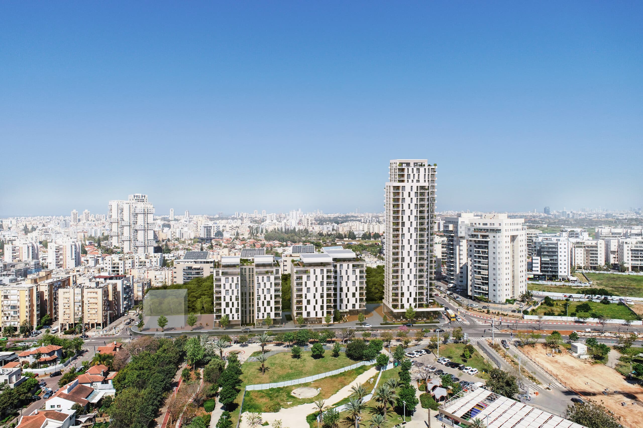 תצלום פנורמי של מתחם מגורים עם מגדלים גבוהים ומבנים נמוכים בעיר גדולה ביום בהיר, כולל פארק ירוק בחזית.