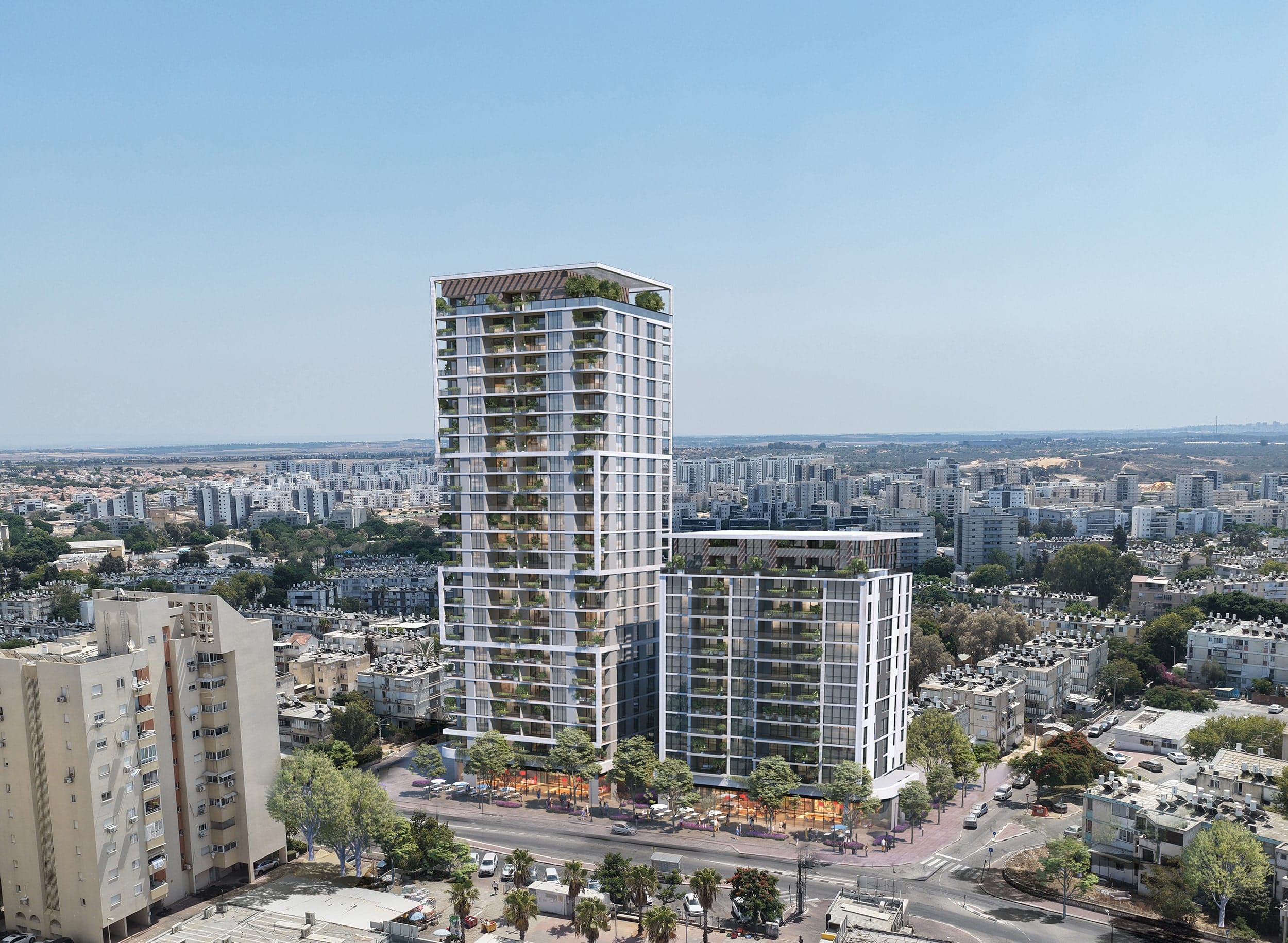 מגדל מגורים גבוה ומבנה נמוך יותר עם ארכיטקטורה מודרנית, בלב עיר עם המון בניינים רבי קומות מסביב, ותחבורה בכביש הסמוך.